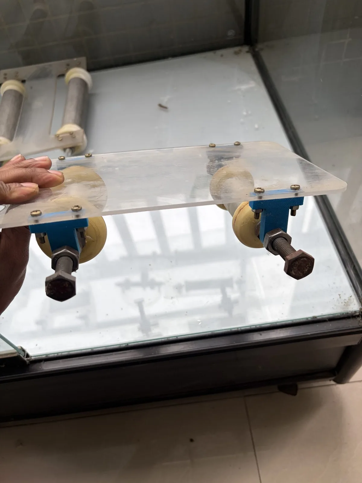 The inertia car held in a hand, front view