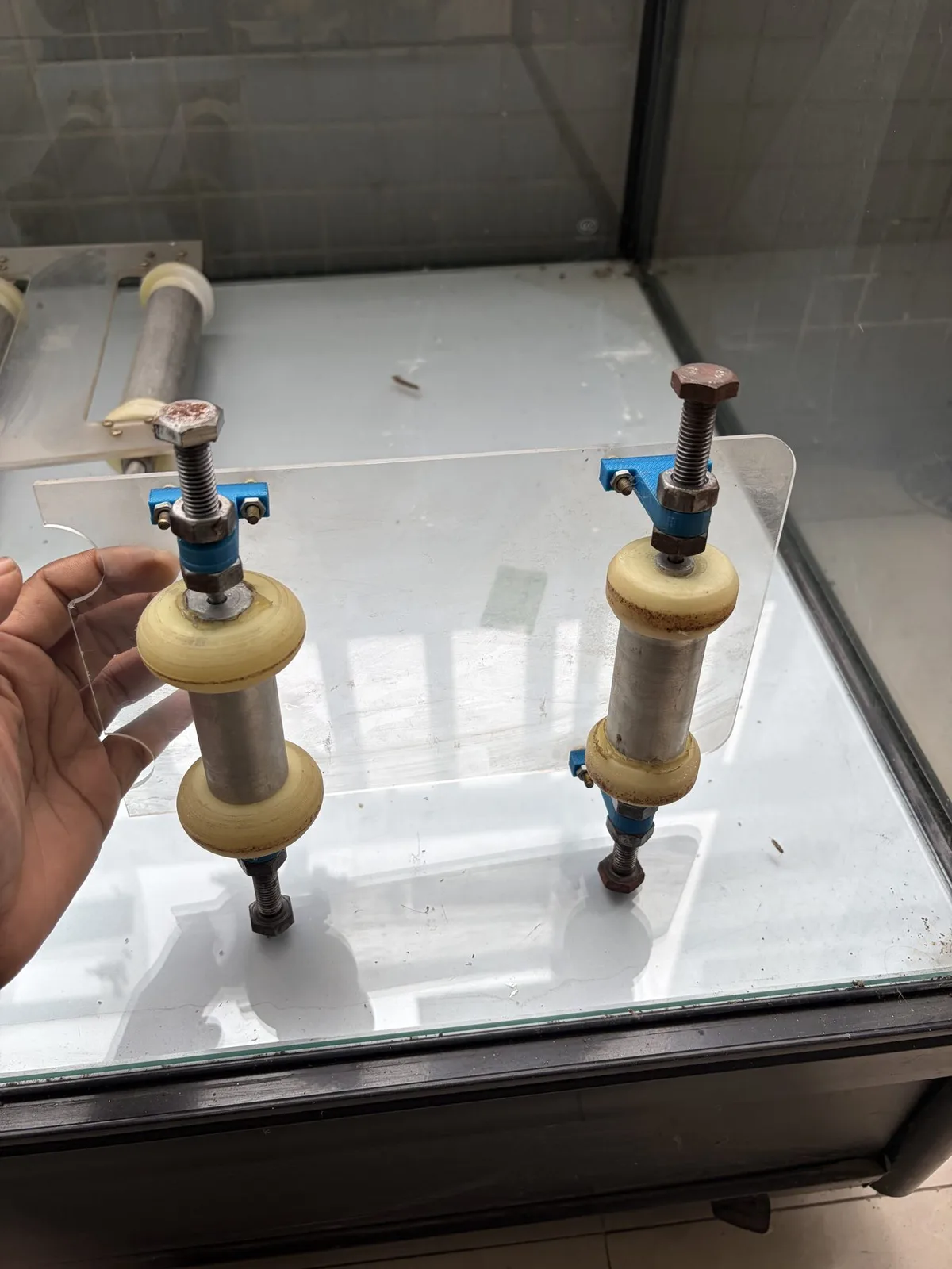 The inertia car held in a hand, side view